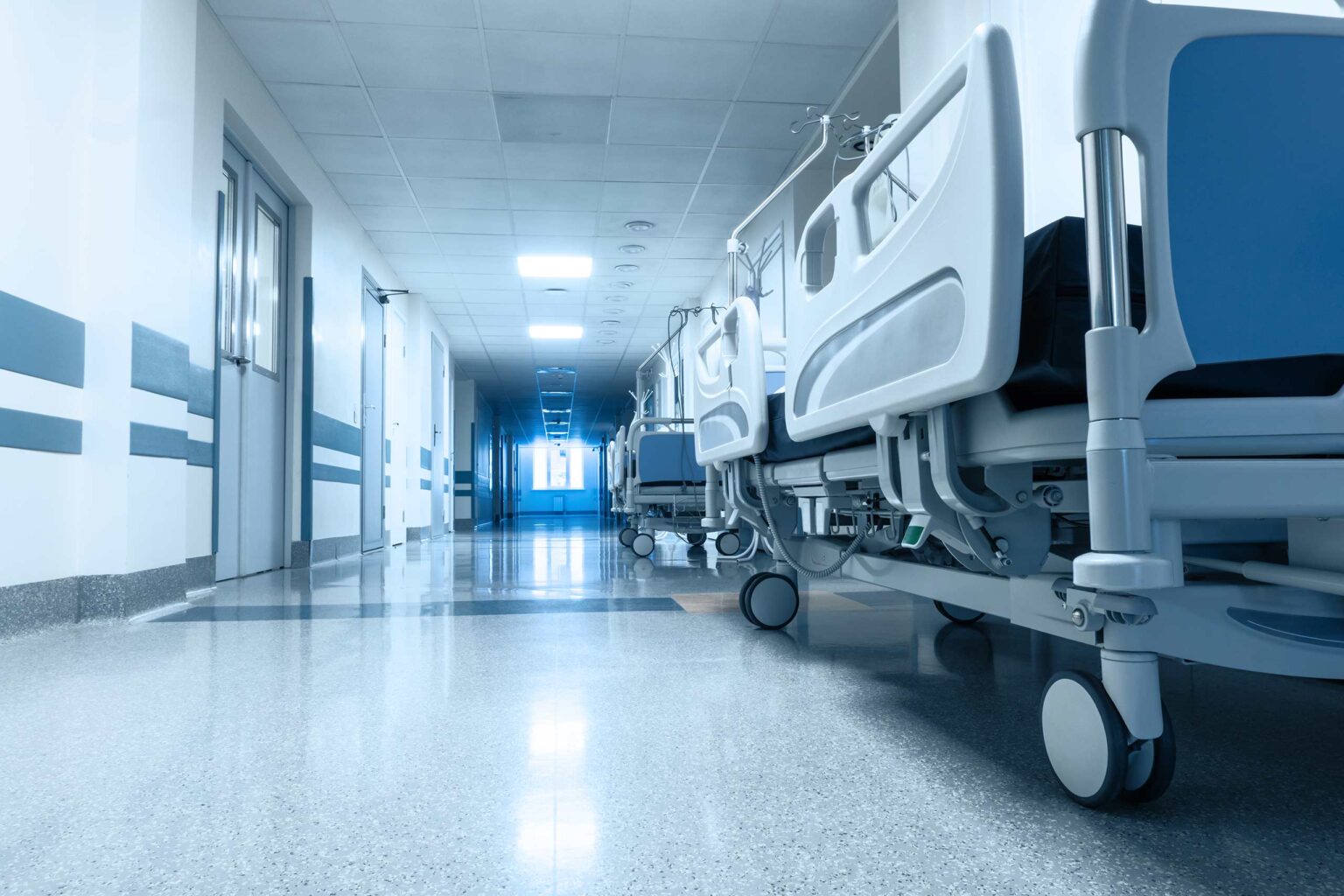 Long corridor in hospital with surgical transport. Long corridor in hospital with surgical transport.