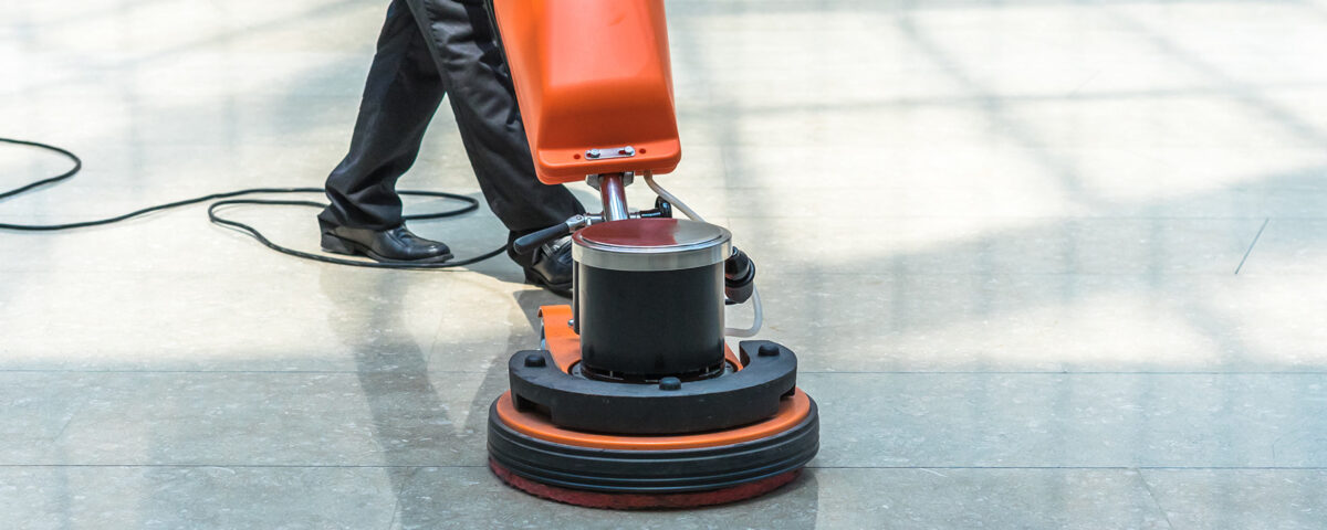 cleaning floor with machine