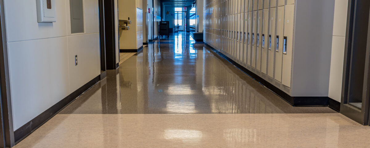 Interior of a bright, empty school hallway: back to school concept, coronavirus concept