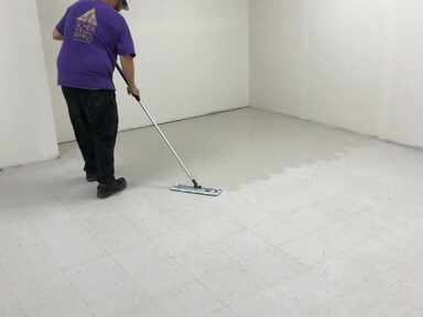 VCT Finish Application Scher Flooring Services applying VCT finish