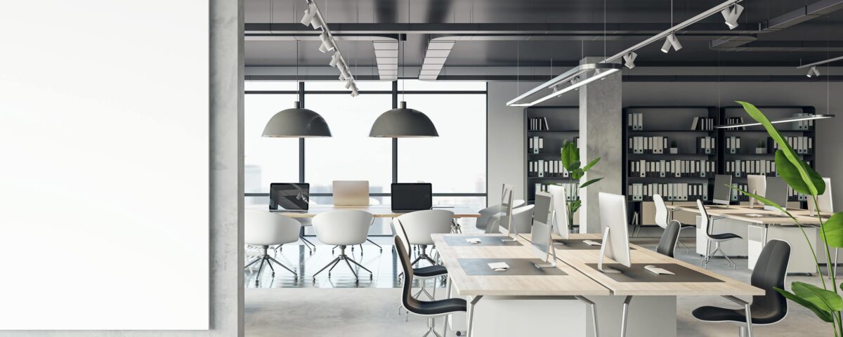 Front view of blank white isolated poster on a light grey wall at the entrance to modern loft office interior with concrete floor and window with city view. 3D Rendering, mockup, template background
